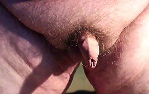 Fat boys tiny penis being pushed around while standing up.
