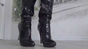 She cut the black boots with scissors and tore them with her hands b