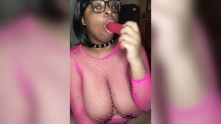 Nerdy Big Boobed Black Beauty Sucking Off on a Sex Toy