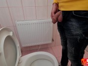 Uncircumcised cock pees on the station toilet
