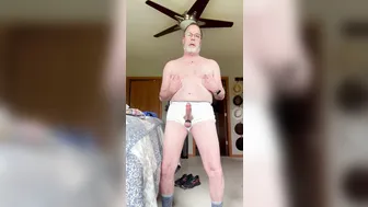 Hairy daddy bear strips and strokes big cock to cumshot