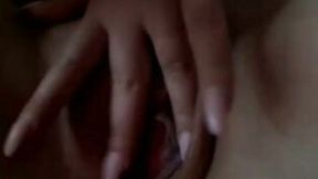 My sweet girlfriend is playing with her charming pussy