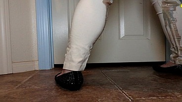 Mia Hope pissing her dress pants outside bathroom
