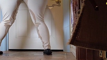 Mia Hope pissing her dress pants outside bathroom