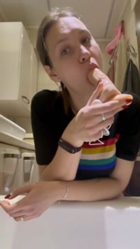 Hottie plays in the bathtub with a rubber dick while no one is watching