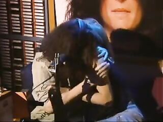 Howard Stern kisses & massages Gretchen Becker’s (Actress) booty.