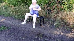 a neighbor in the park undresses and masturbates to orgasm on a bench