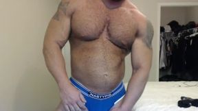 Muscle Hunk Has Fun Flexing