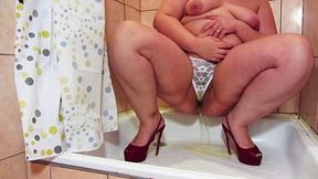 Hairy and chubby beauty pees in her white panties and nylon tights.