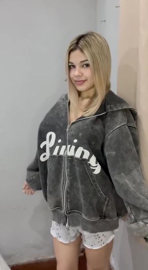 Hoodie-wearing blonde-haired babe reveals her slim figure to the camera and indu