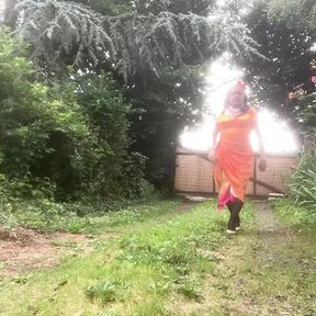 In orange dress outdoors