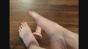 Miss Lex Measures Feet Against a 6 inch dlldo