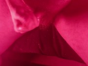 Masturbating with an overhead view with nice red lights