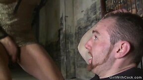 Three she-males and captured man engage in intimate activity