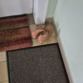 Cum into stil warm shoes of m neighbour in the hallway