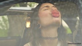 messy pink lipgloss marks on the car window