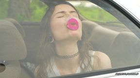 messy pink lipgloss marks on the car window