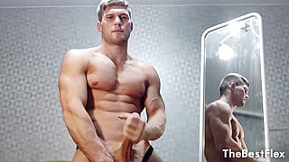 Muscled Hunk Stroking His Dick by the Mirror