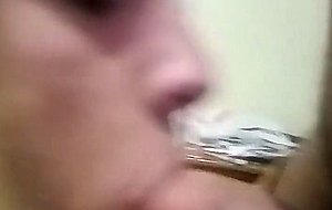 Sissy in chastity sucking cock
