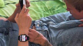 Guy gives throat to friend while he plays on phone