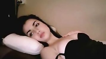 Indian brunette with not so big boobs is performing on cam, every once in a while