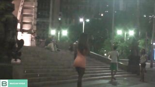 Dark Haired lifting the dress into outdoor into the middle of the citys traffic. ( Full