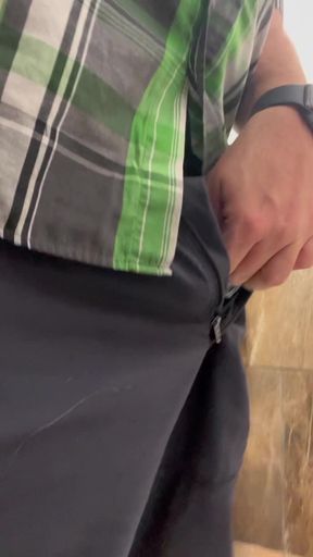 Solitary pisser shows off her wet cock