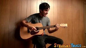 Handsome young man enjoys his guitar and jerkoff solo