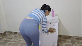 Horny Latina stepmother masturbates on top of her freezer at home