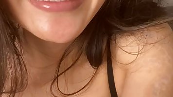 Busty brunette in erotic, black lingerie, Rae Lil Black is posing and teasing on cam