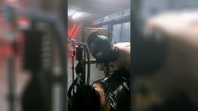 The helpless slave suffers with a breathing mask during hard dilation.
