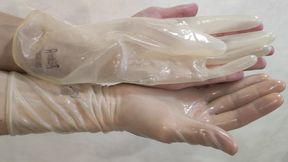 Transparent fetish gloves trying on