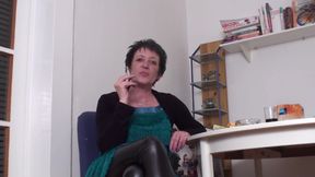 Brunette mature slut smoking a cigarette