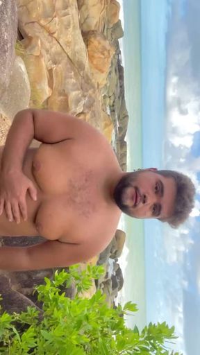 Chubby gay showing off on the beach