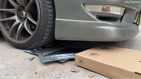 Brand new laptop crushed under My car wheels