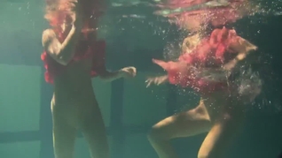 Russian lesbian girls swimming in the pool