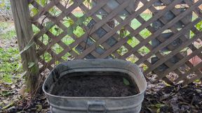 Fifi loses a pair of clear light blue high heels in a bin of deep mud