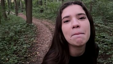 Busty brunette teen gives a wet and wild blowjob in the forest