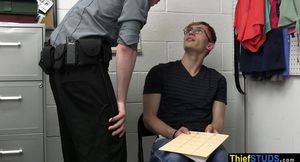 Handcuffed teen thief in glasses learning the rules on cops enormous penis