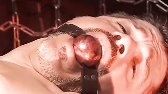 Bound muscle hunk takes baseball bat anal while clamped and restrained