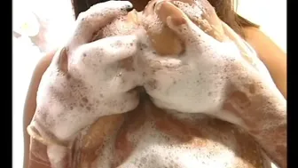 Ebony brunette Shantay plays with her big tits and hairy pussy in the kitchen