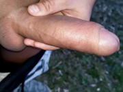 Pulling foreskin back and forth on glans and cumshot outdoor