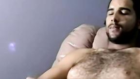 ”Bearded dude with hair on chest jerks off in amateur video”