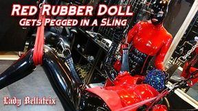 Red Rubber Doll Gets Pegged in Sling