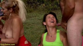 Two curvy athletic matures take a pee break in nature.