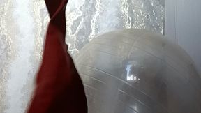 Val on yoga ball play with hearts balloons