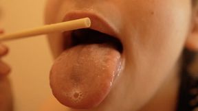 I’m sucking and licking a popsicle, playing with it using my lips and mouth.