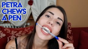 Petra chews a pen -fullHD