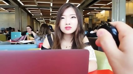 Cute asian girl with remote vibe outside