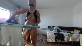Amateur mom does chores in the naked house.